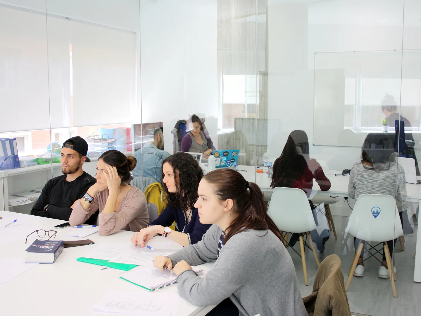 People working in a classroom at Exam Madrid Academy in Madrid.