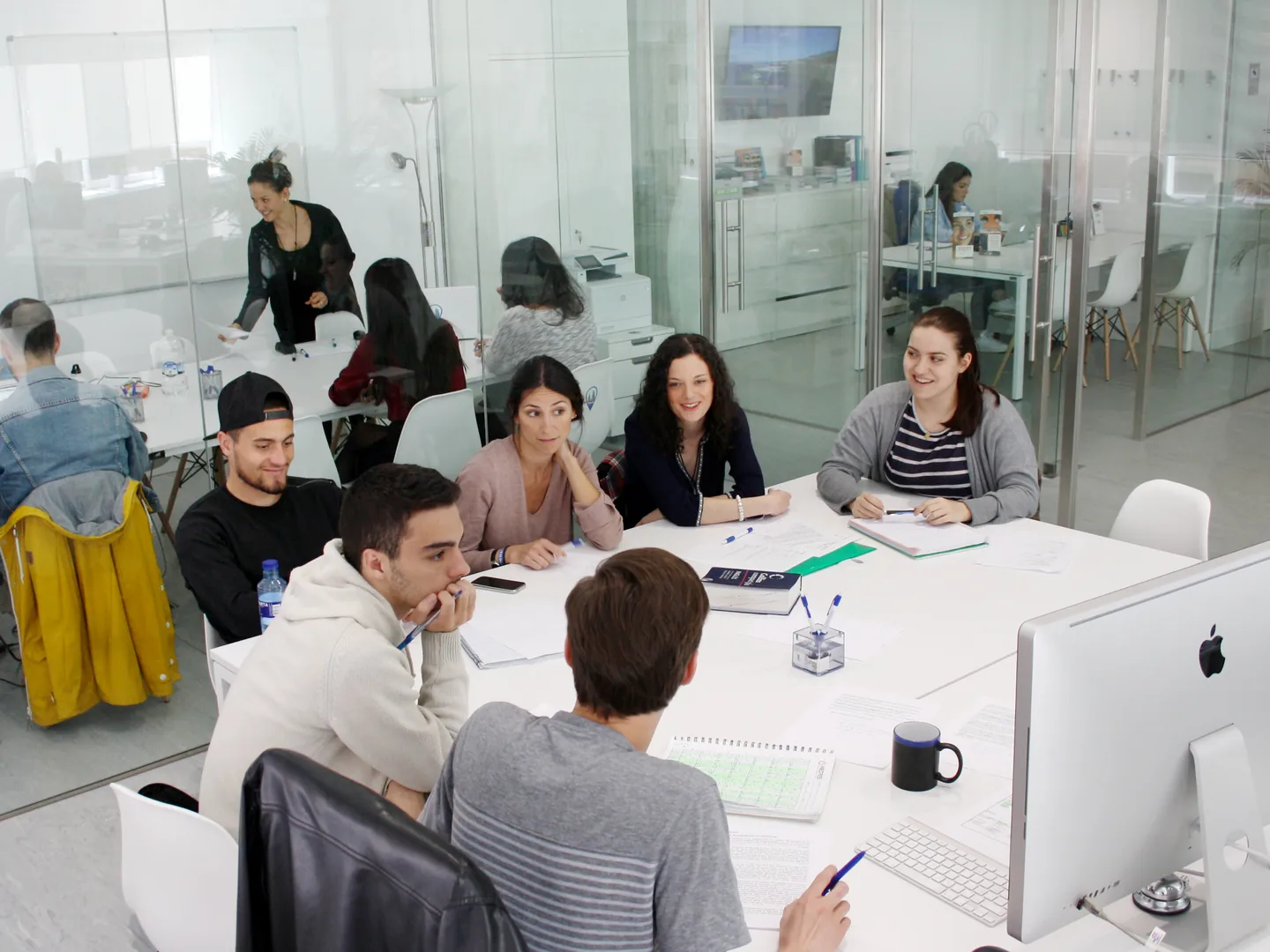 People taking part in a class at Exam Madrid Academy.